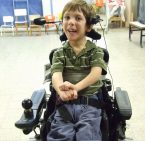 Older-Boy-in-wheelchair-braces-headset[1]